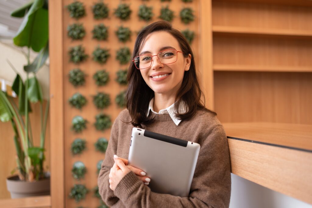 Woman in glasses with tablet computer